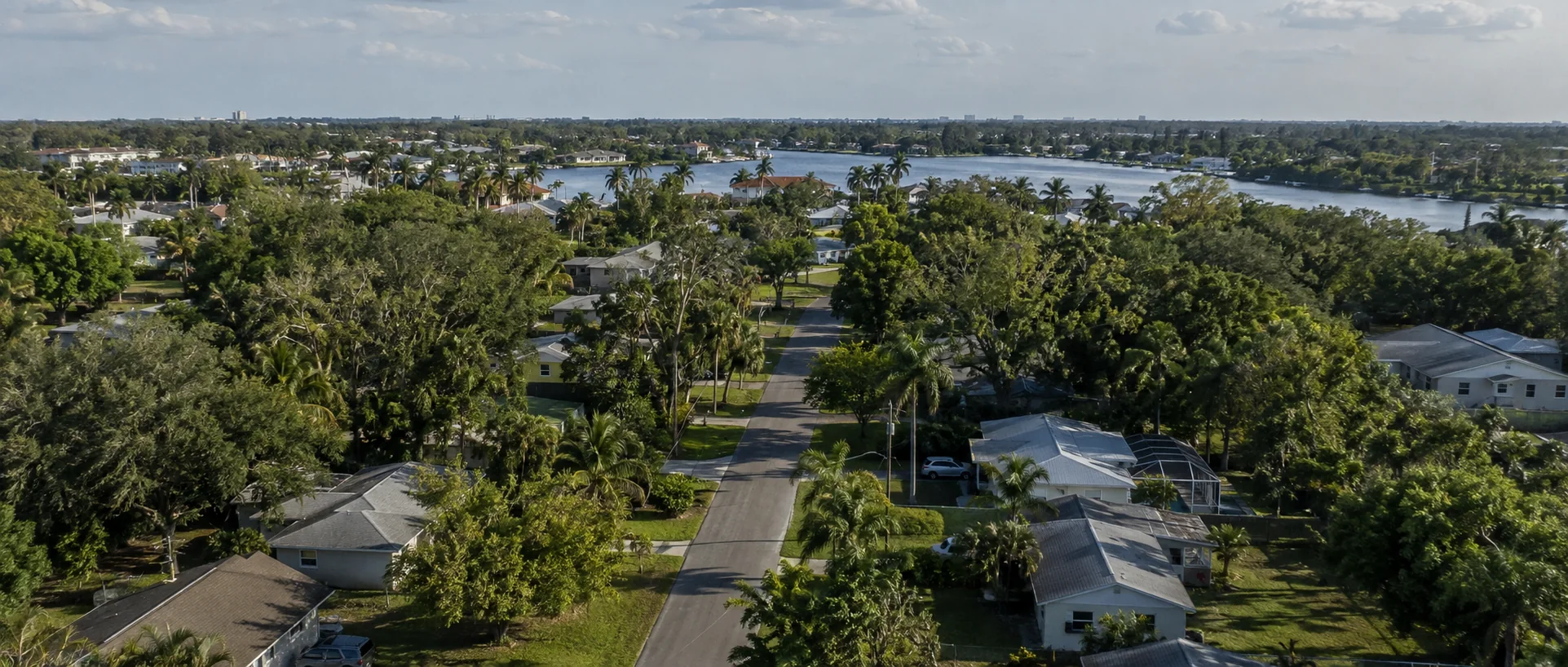 Historic buildings and palm-lined streets representing Downtown Fort Myers’ River District.