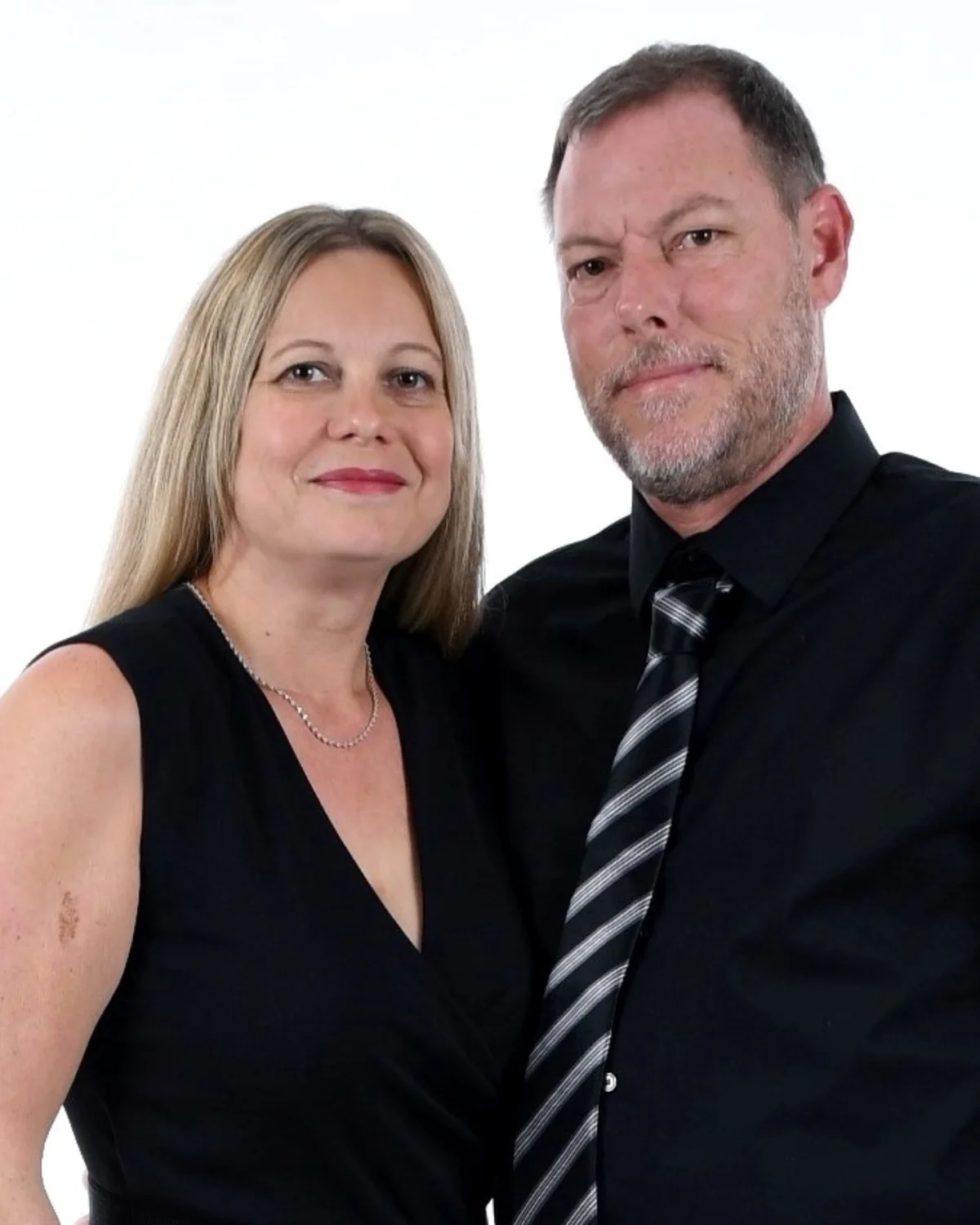 Carsten, alongside Christina, in a professional studio portrait