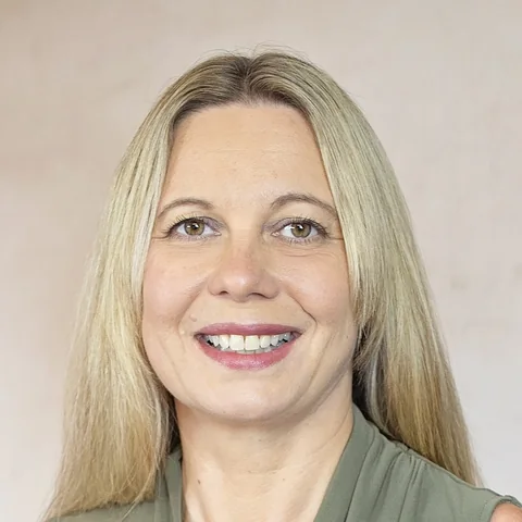 Christina Kalkmann, seated studio portrait