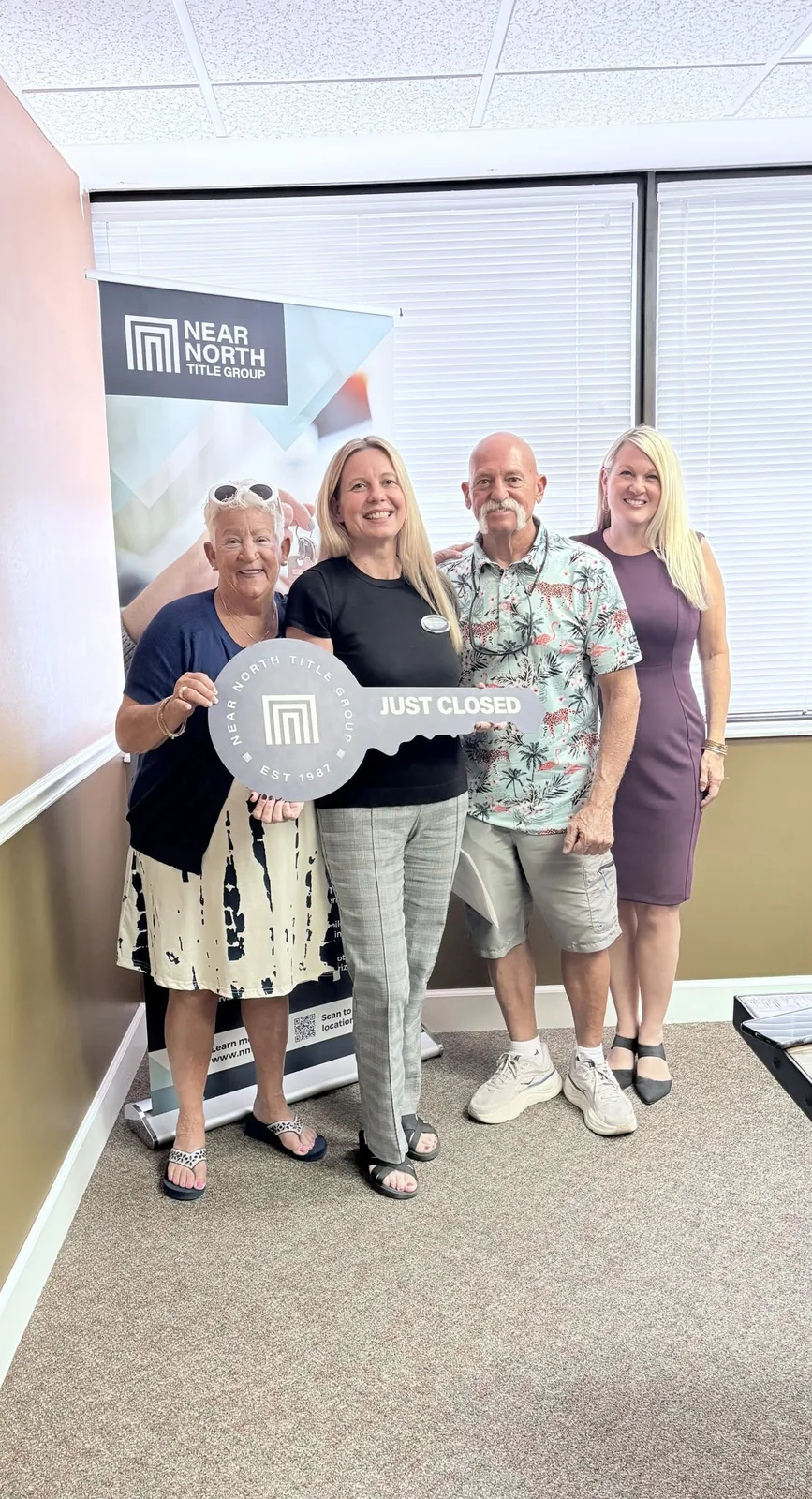Christina Kalkmann with clients celebrating a Southwest Florida home closing.